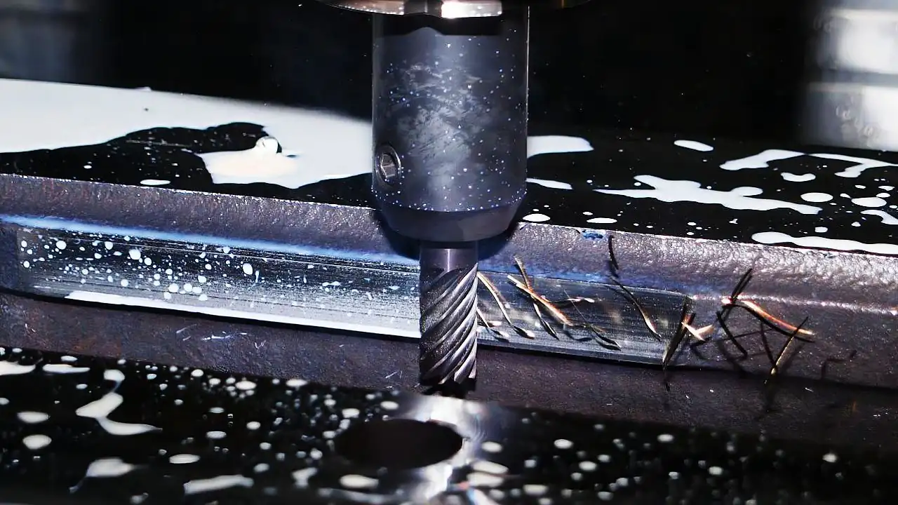 End mill cutting a fine detailed feature into a steel workpiece