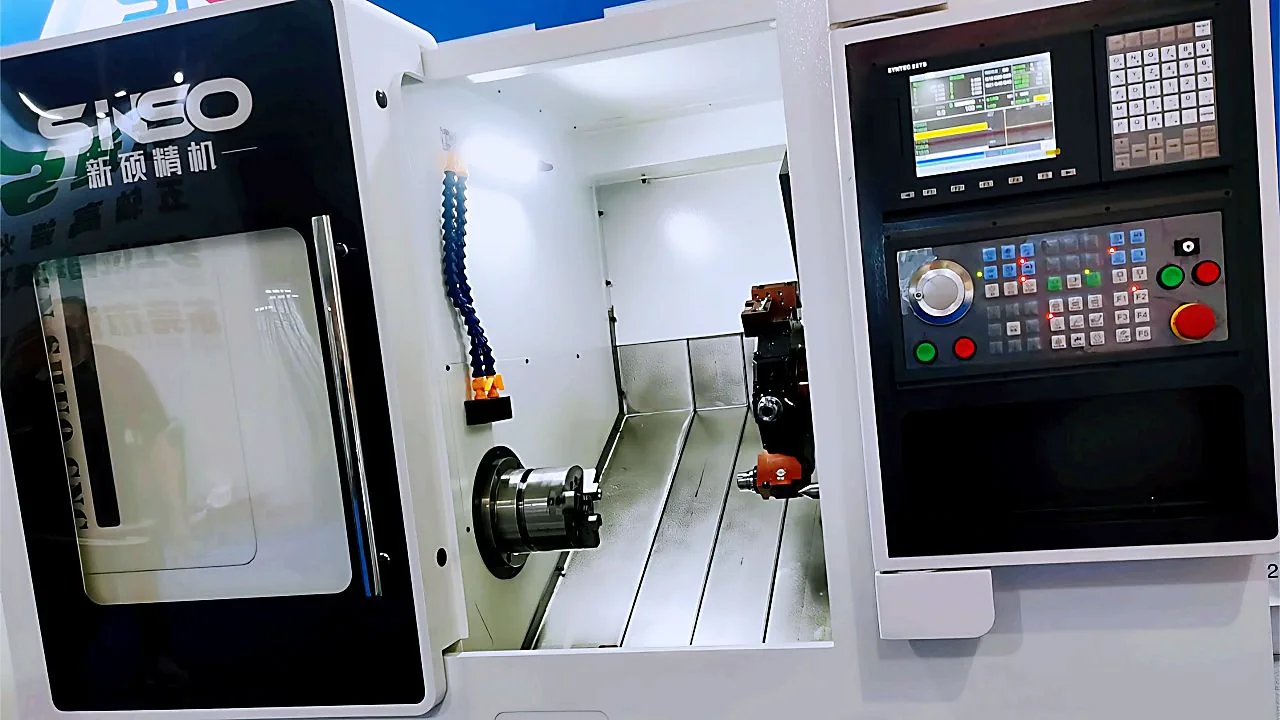 CNC turning centre with the tool and workpiece visible through the guard