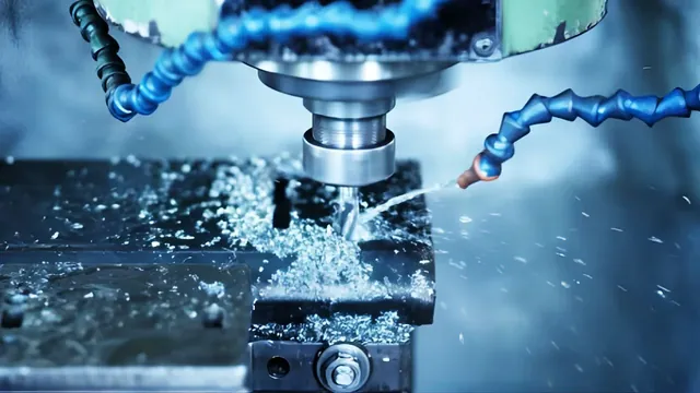 Milling head cutting a metal part with coolant flowing over the cutter