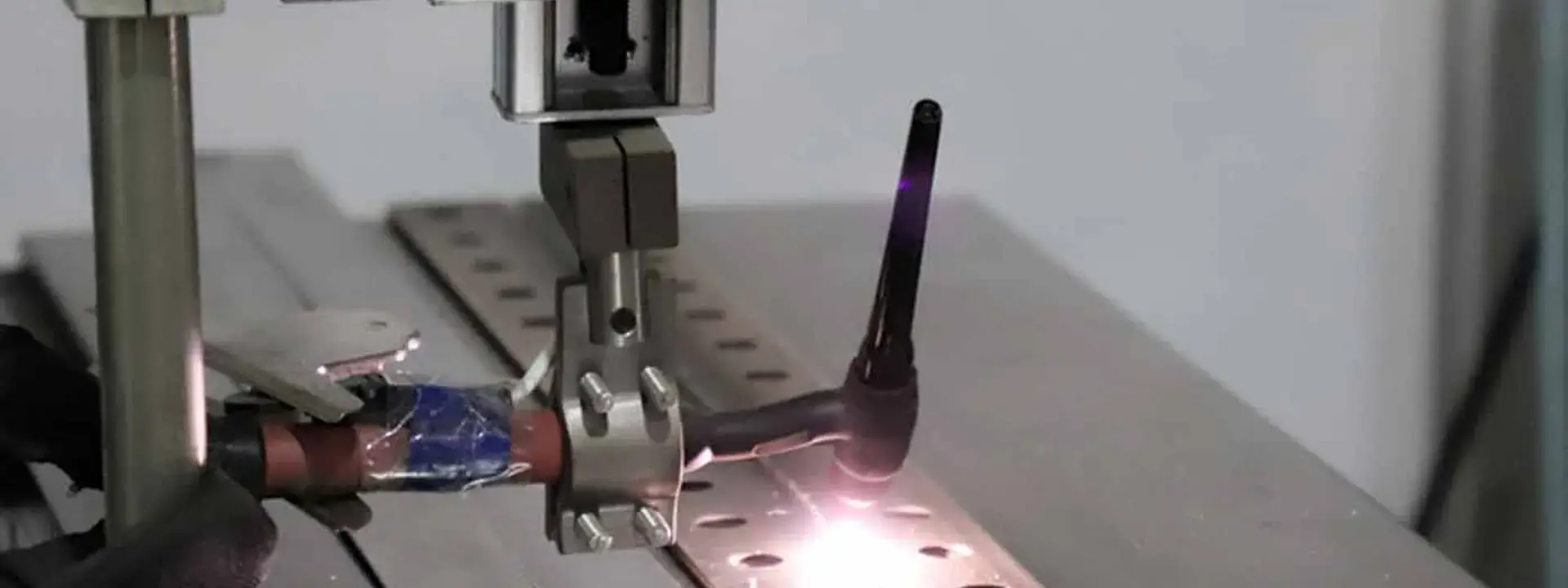 Seam welding a perforated strainer screen at the Wodong workshop