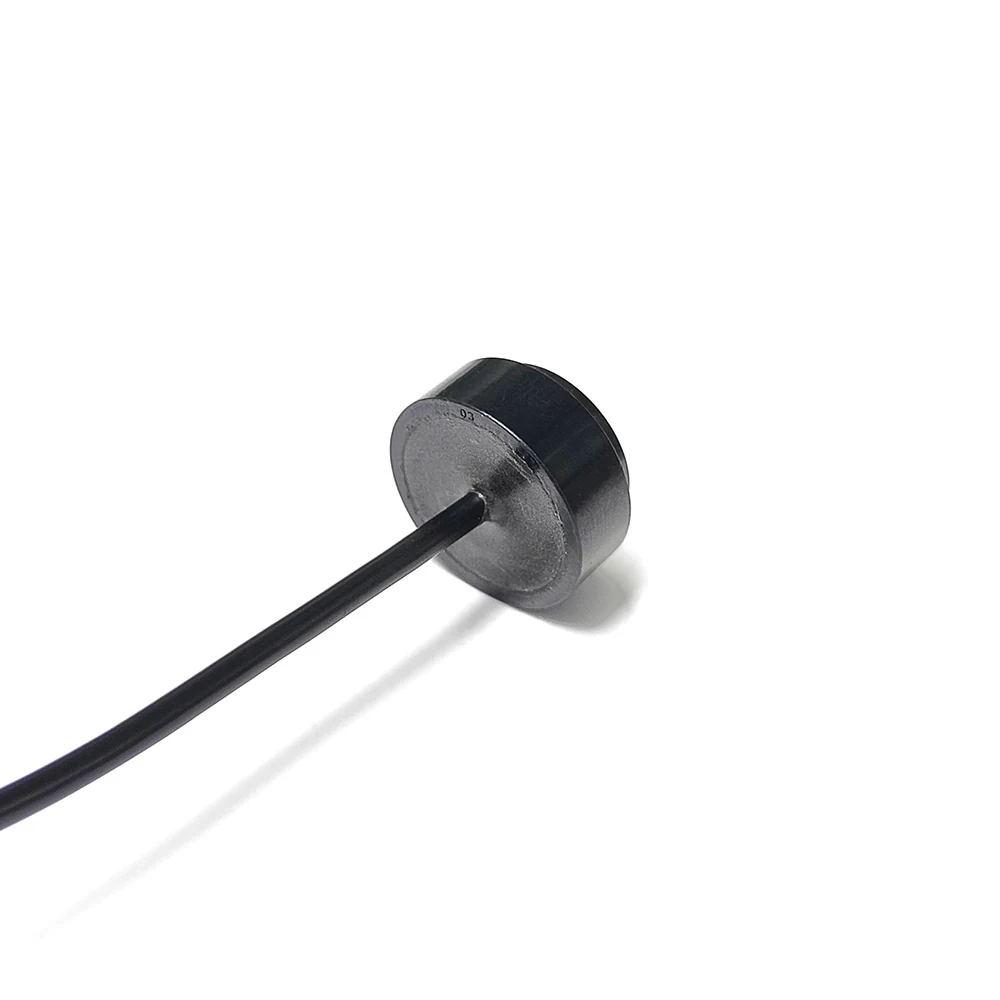Ultrasonic Flow Sensor 2MHz slim variant, a low-profile dark metal disc with a fine black lead exiting the rim