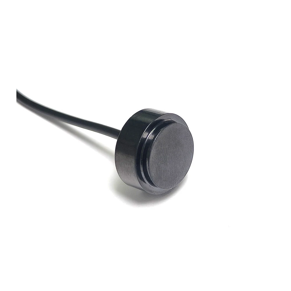 Ultrasonic Flow Sensor 2MHz with polished stainless steel face set into a dark metal housing and black lead