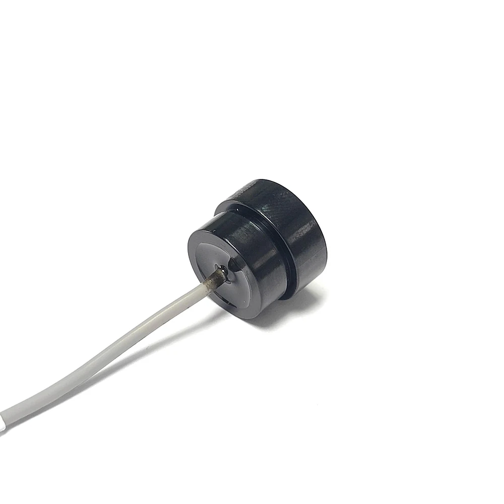 Ultrasonic Material Recognition Sensor 1 with black housing, white ceramic emitting face and single grey lead wire