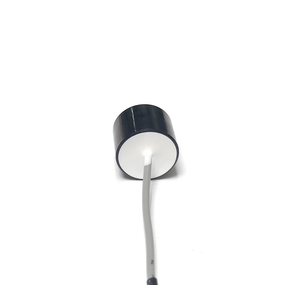 Ultrasonic Material Recognition Sensor 3 seen end-on, showing the full ceramic emitting face and the centre-exit lead