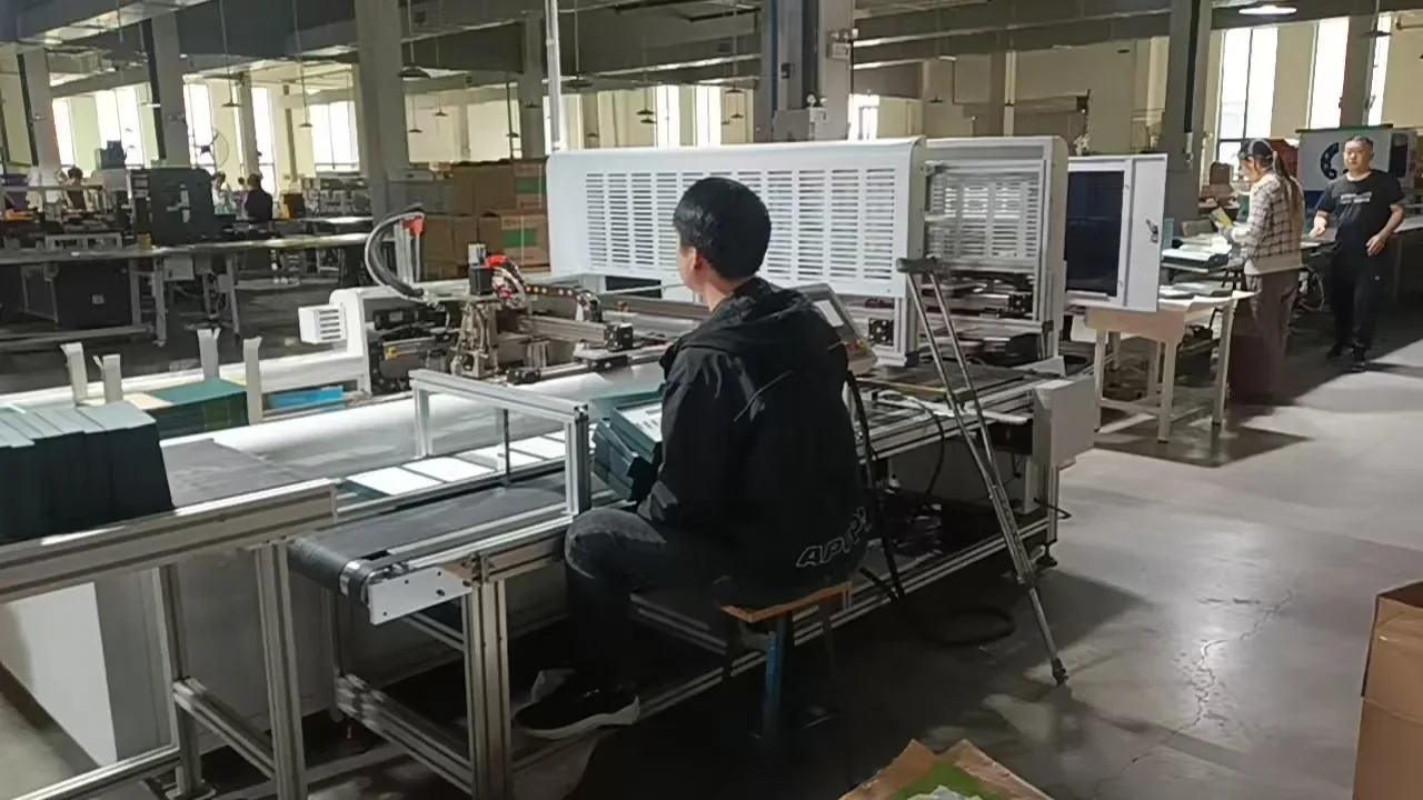 Guorun technician setting up a box assembly machine during final testing