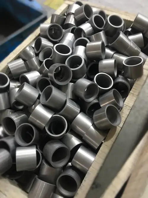 Carbide choke seats after grinding, ready for inspection