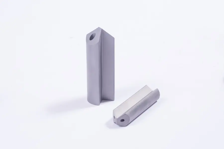 Close view of the V flute ground into a carbide gun drill blank
