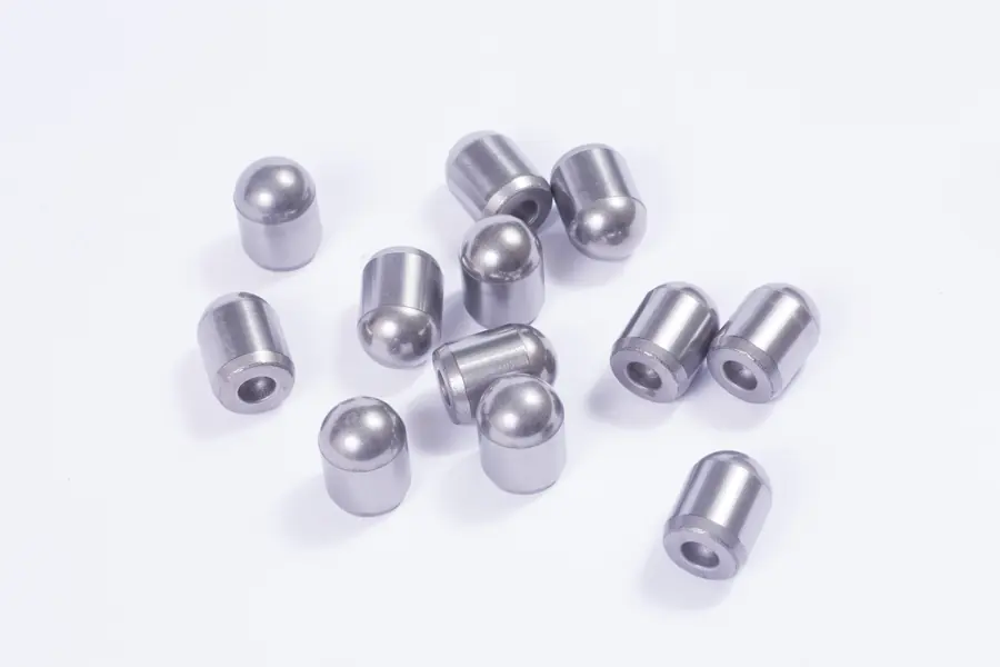 Carbide button inserts with domed and flat tops