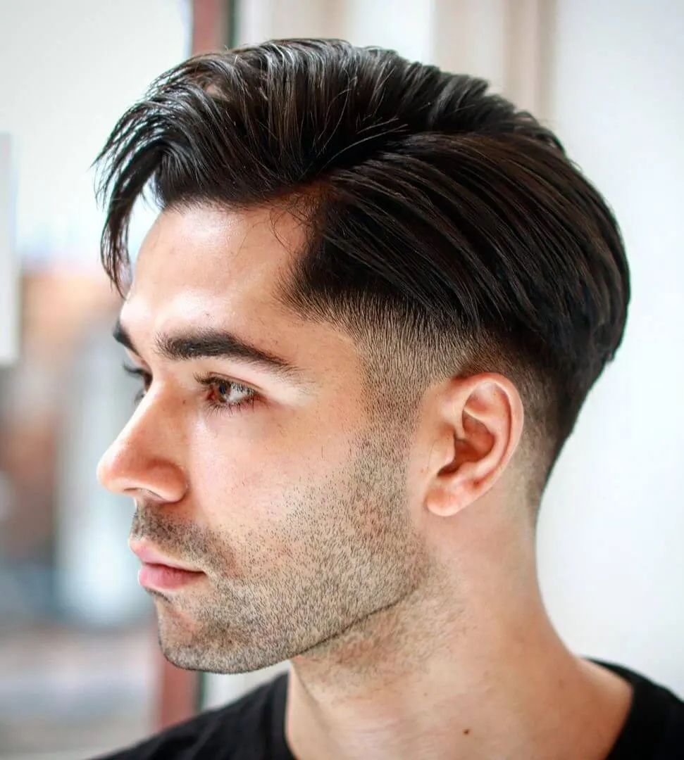 Man wearing a V-loop poly thin skin hair system styled back from the hairline