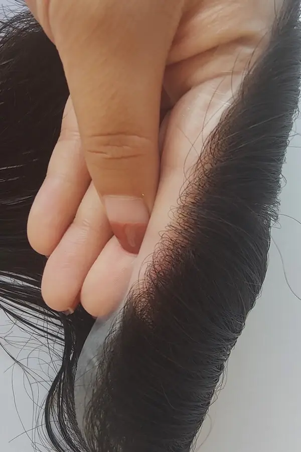 Underside of the super thin skin base showing the transparent material and v-looped knots