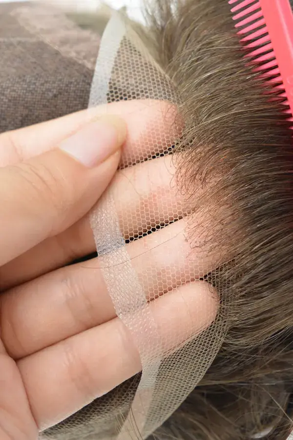Close-up of the lace front with bleached knots on the CUSTOM LW hair system