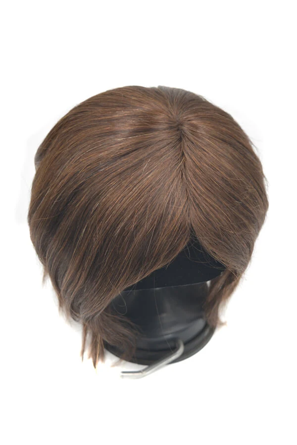 Side view of a custom men's hair system showing the circular PU undervent and silk top base