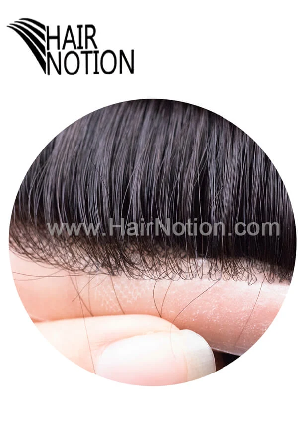 Custom toupee shown from above with the front hairline and clear PU section visible