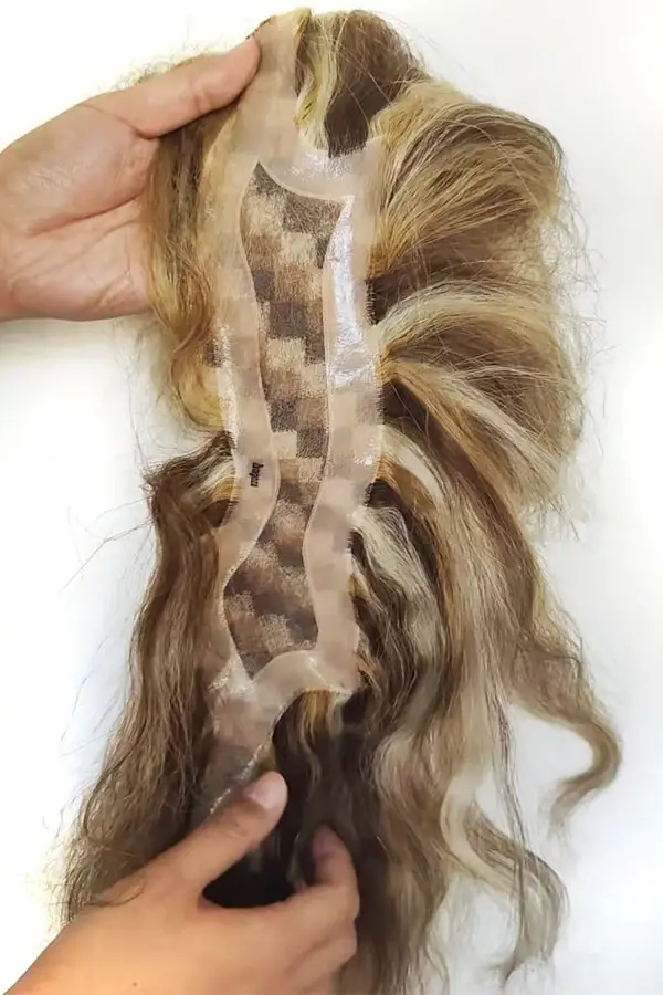 Underside of the frontal hair piece showing the clear PU front contour and mono base structure