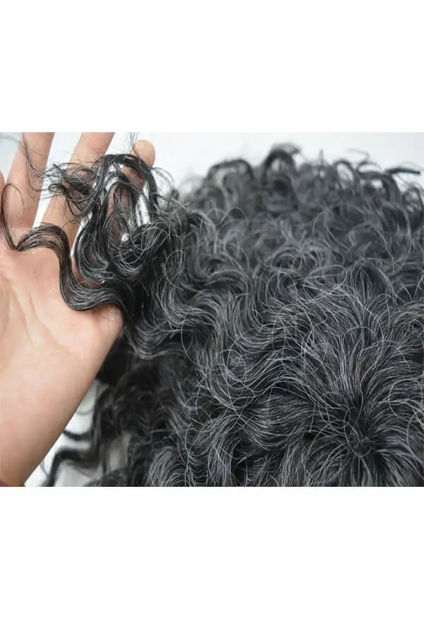 Custom hair system for men being fitted on a mannequin head, showing the full cap size and natural hairline