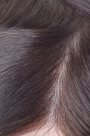Underside of the toupee showing the French lace and diamond lace layers along the perimeter