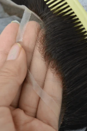 E-AN hair system styled on a mannequin head showing the front parting and natural hairline