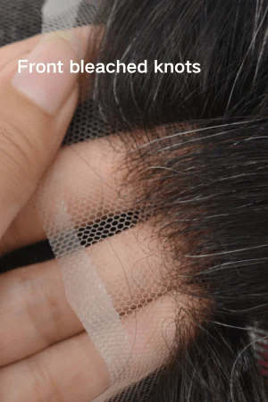 Close-up of bleached front knots on a French lace hair system