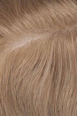 Underside of the thin skin base showing the clear poly material and V-loop hairline knots