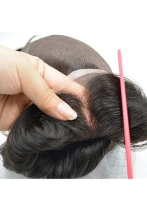 Toupee styled on a mannequin head showing the front parting and natural hairline