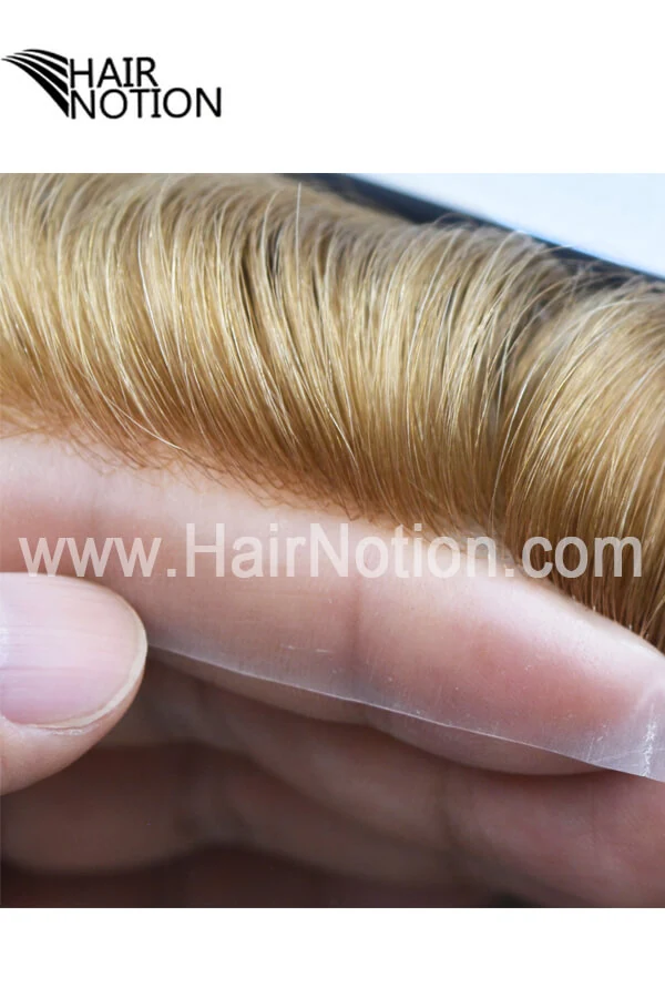 IS-IT injected skin men's hair system shown from above with the front hairline visible