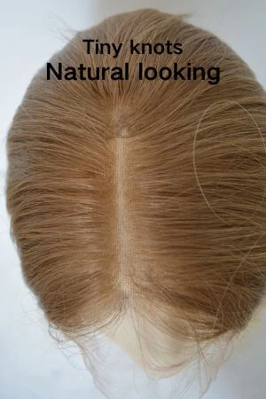 Close-up of the bleached knots at the front hairline showing the natural look