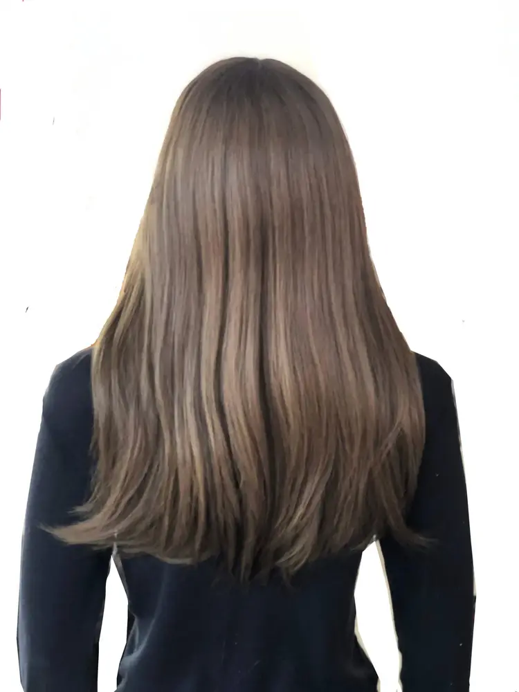 Side view of the Mona 4x4 Lace Top wig showing the natural hairline and dark root effect