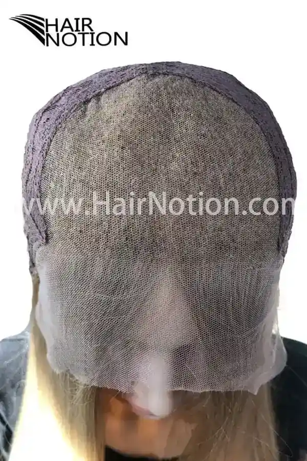 Mona lace top wig styled on a mannequin head showing the front parting and natural wave