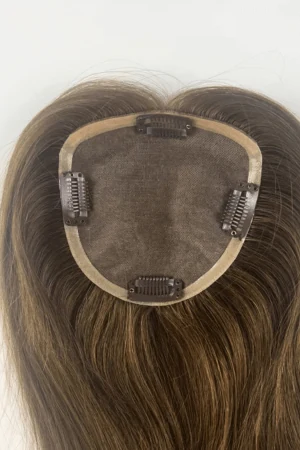 SALIS mono top hair topper shown from above with the front hairline and clips visible