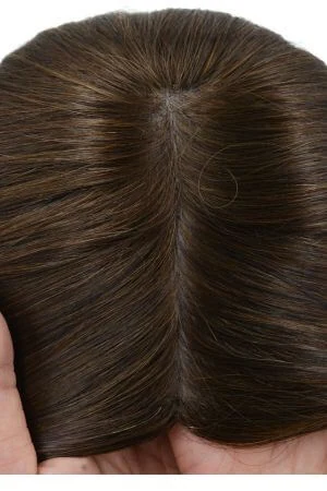 SAURA topper styled on a mannequin head showing the natural hairline and crown coverage