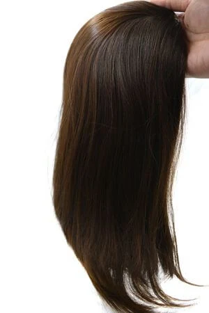SAURA topper styled on a mannequin head showing the natural parting and crown coverage