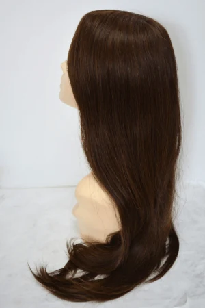 AURA hair topper styled on a woman's head showing the full coverage and natural blend with natural hair