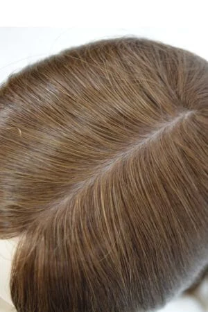 Underside of the AURA silk top base showing the closed weft perimeter and integrated clips
