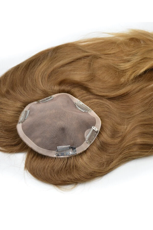 Women's topper on full Swiss lace base shown from above with the front hairline visible