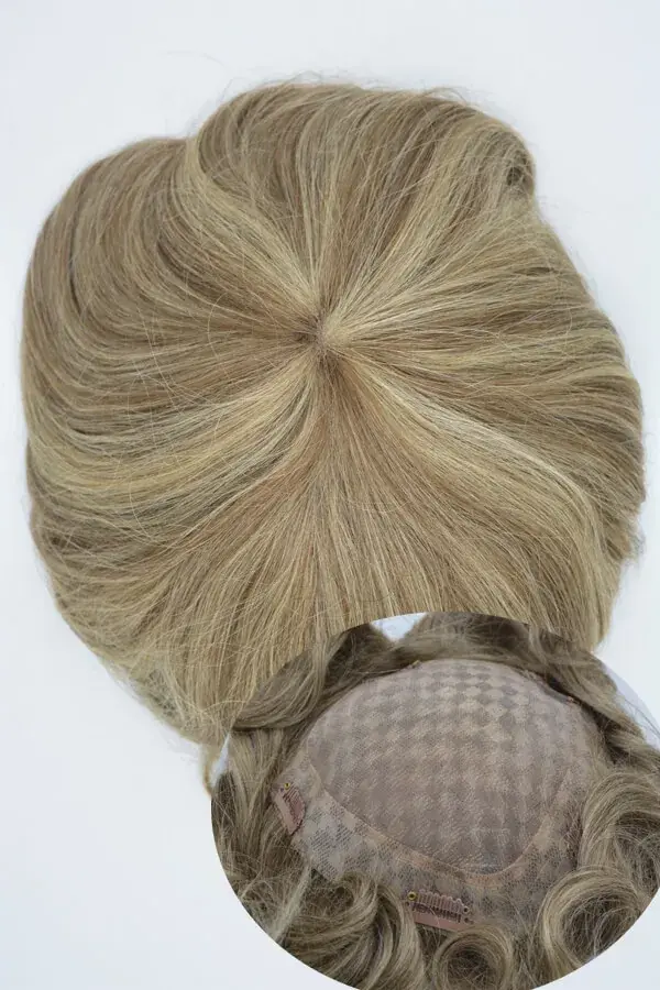 Women's hair topper on full Swiss lace base shown from above with the front hairline visible