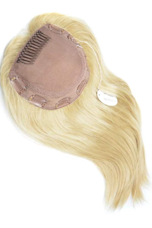 Women's real human hair topper shown from above with the front hairline visible