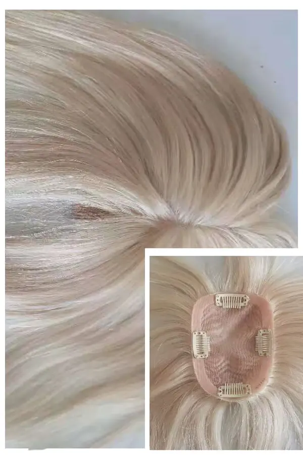 Women's topper with transparent mono base and white hair shown from above, highlighting the natural hairline and clip-in attachment