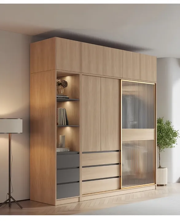 Light oak sliding door wardrobe with a frosted glass panel and an illuminated open display section
