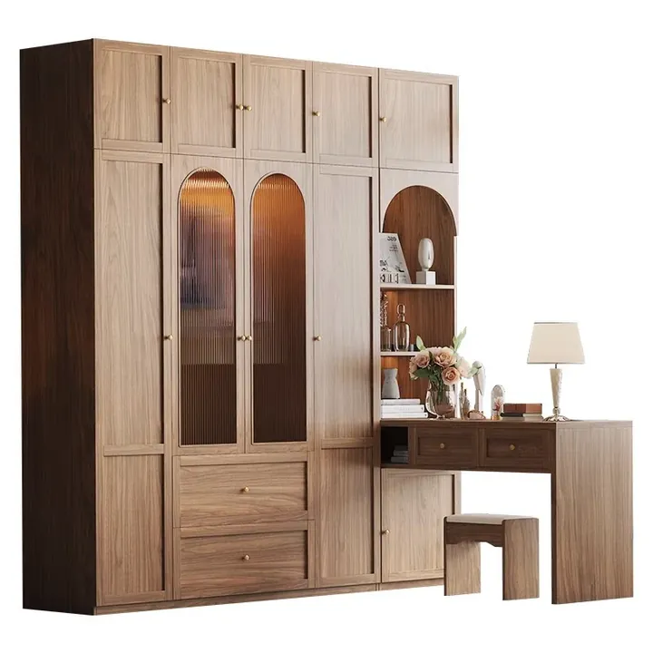 Walnut finish wardrobe with arched ribbed glass doors beside a matching dressing table and stool