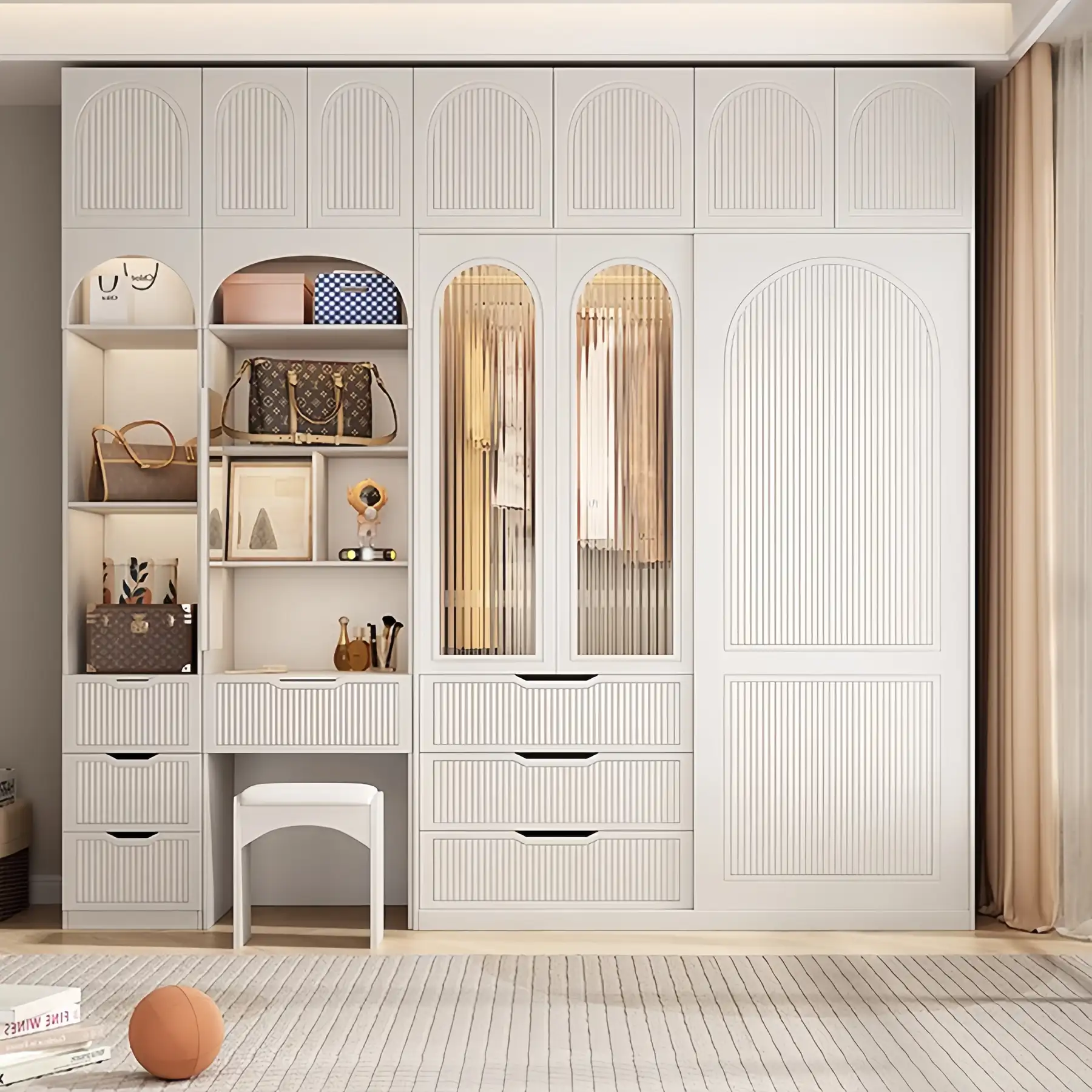 Cream wardrobe with arched door panels and an integrated desk and shelving column