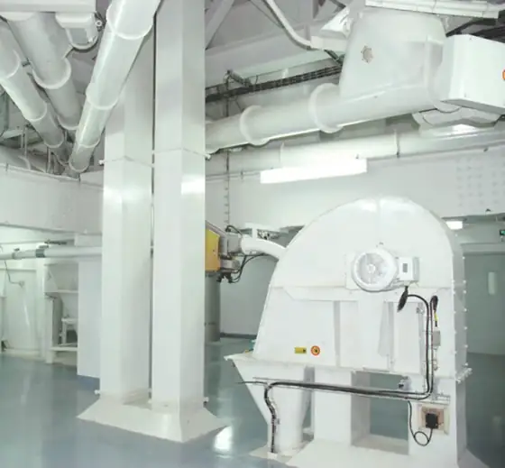 Bucket elevator boot section with inspection door and belt tensioner