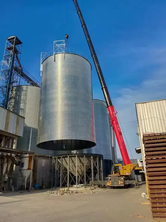 Bolted corrugated silo shell above a steel hopper bottom