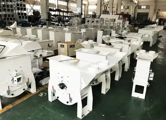 Rice milling machines staged in process order before packing, so transfer points are checked in the factory.