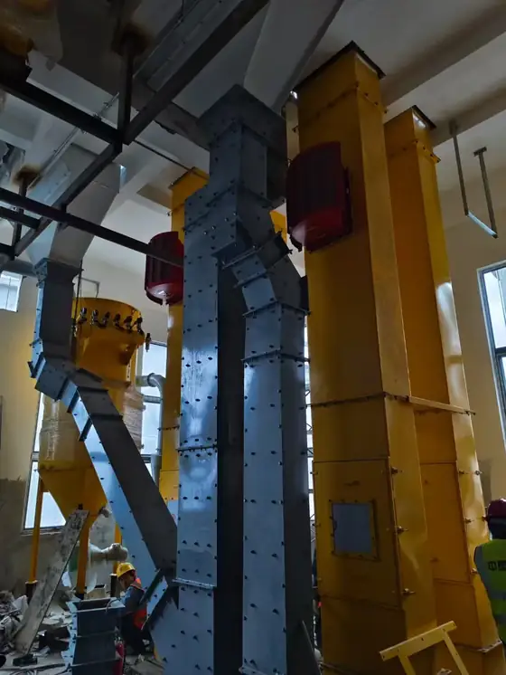 Construction site with concrete silo foundations and steel structure