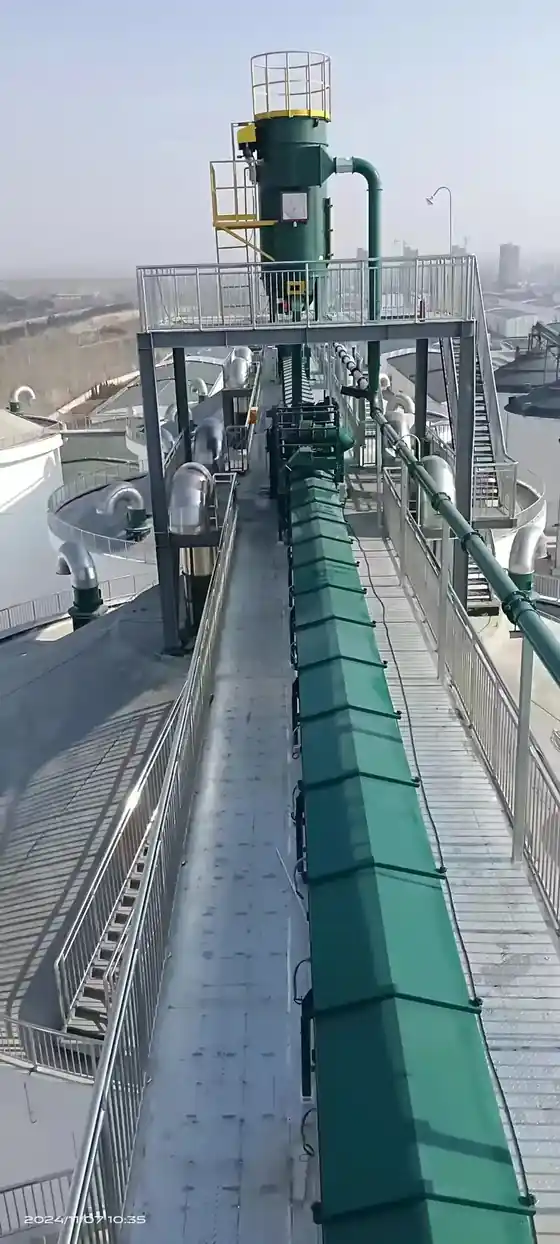Galvanized silo shell bolted ring by ring during erection