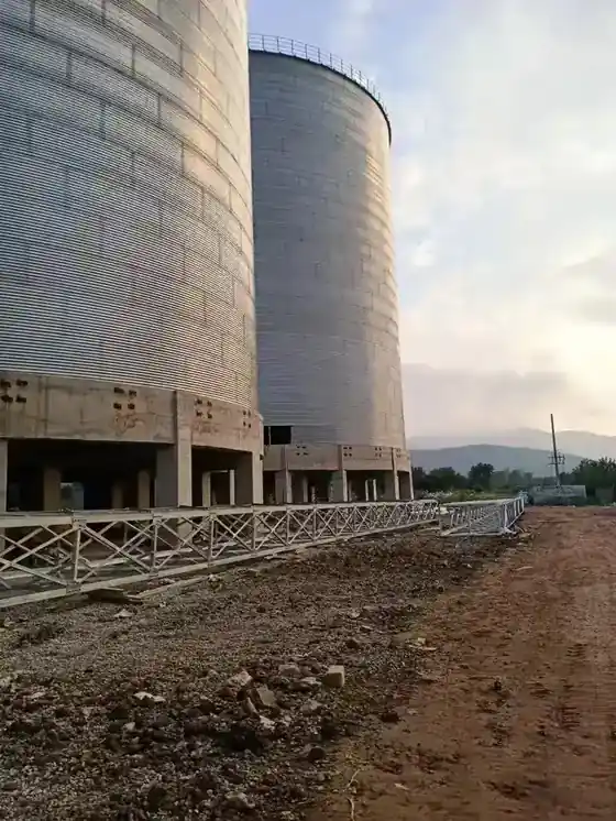 Bolted corrugated sidewall sheets with vertical stiffeners on an erected grain silo
