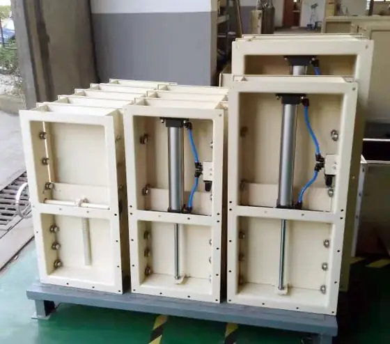 Bucket elevator head section with discharge chute