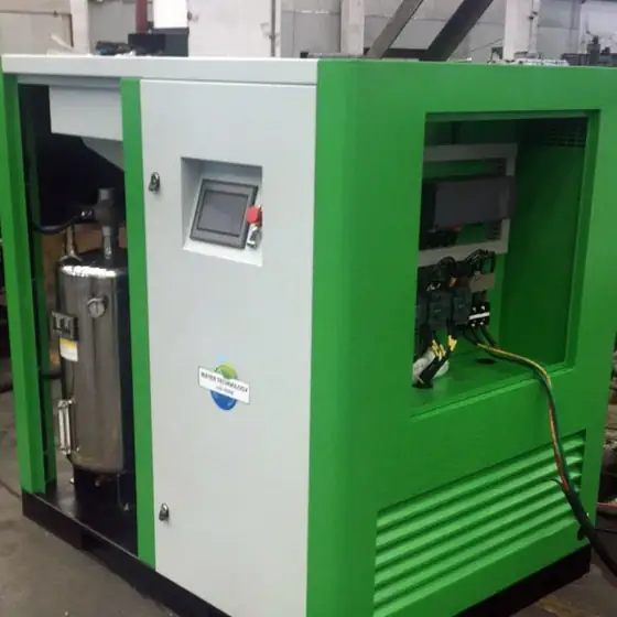 Oil free compressor with green cabinet and control panel in a processing plant