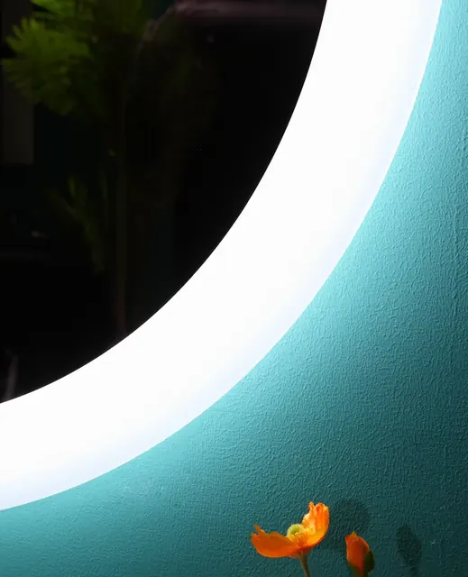 Standard white frosted glass band on a round backlit mirror