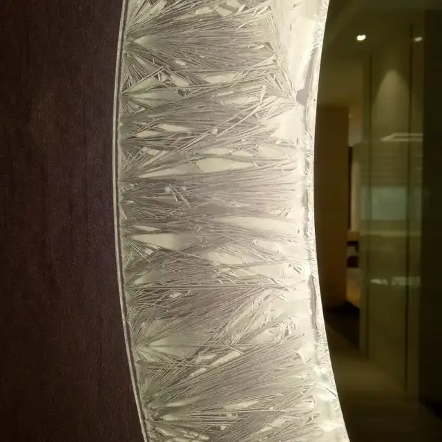 Ice flower frosted glass style for a lighted mirror